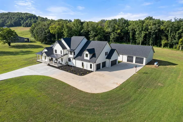 a view of a hallway with a dining table and a fire place