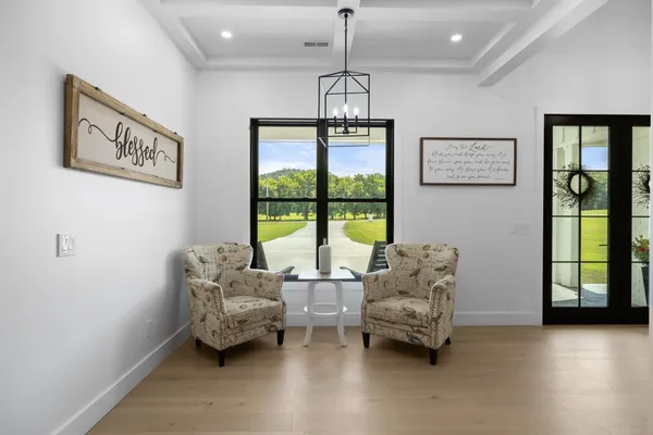 a kitchen with kitchen island granite countertop a large center island a dining table and chairs
