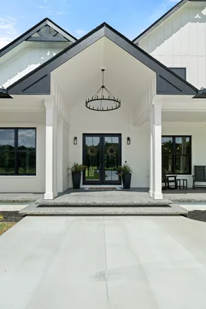 a living room with patio furniture and garden