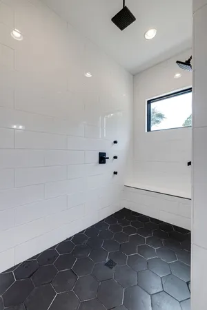 a bedroom with a bed and a mirror