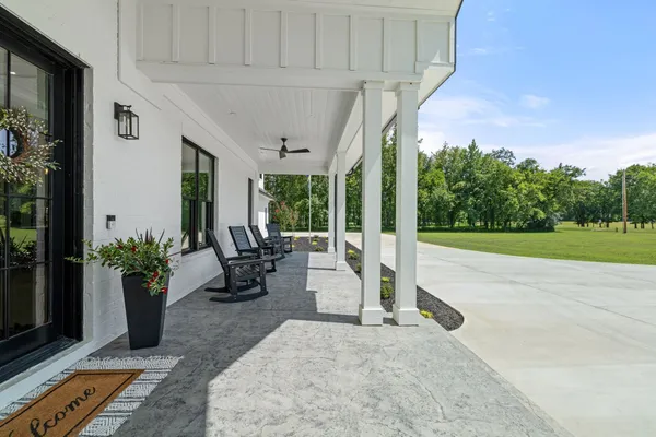 a view of swimming pool with outdoor seating