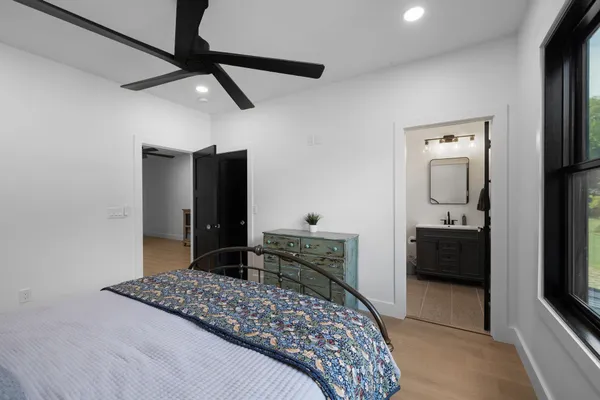 a view of a large garden with plants and large trees