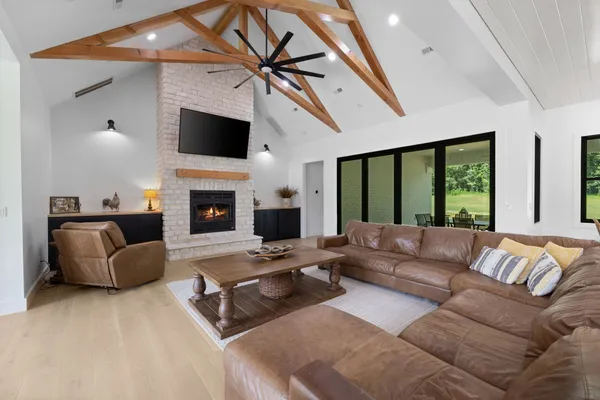 a living room with furniture and a large window