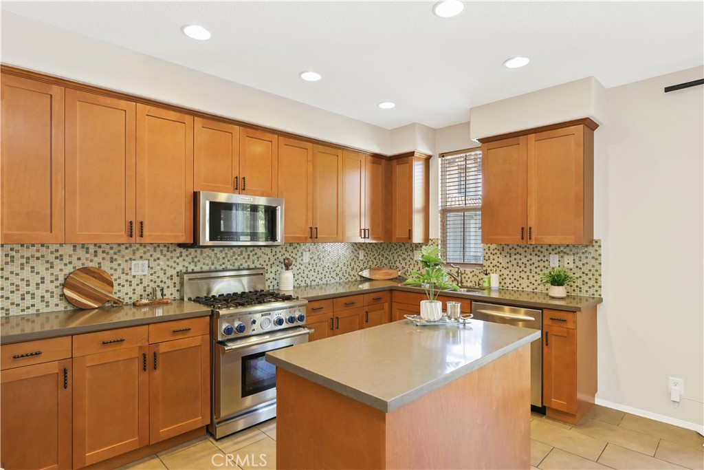 23 Crosspointe Irvine, CA 92618 - Photo 17 of 47 a kitchen that has a sink and a stove in it