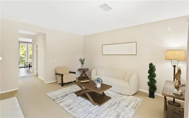 a living room with furniture and a couch