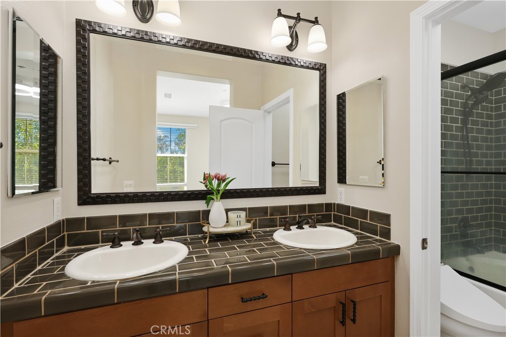 23 Crosspointe Irvine, CA 92618 - Photo 31 of 47 a bathroom with a sink and a mirror