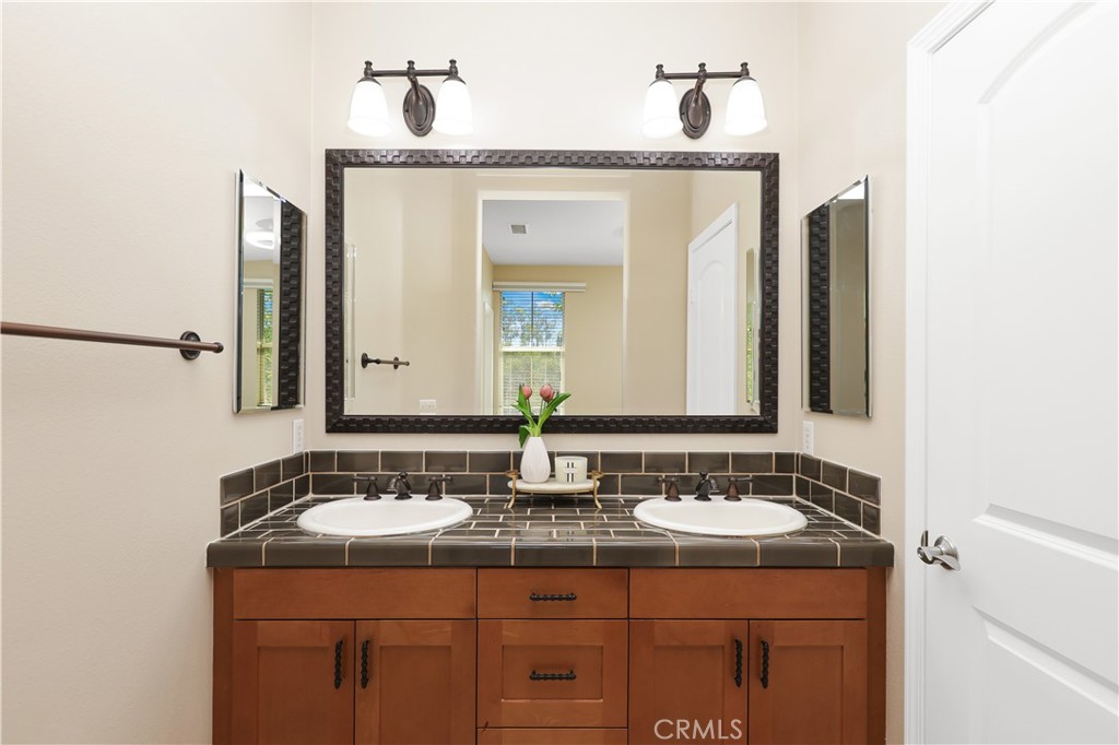 23 Crosspointe Irvine, CA 92618 - Photo 33 of 47 a bathroom with a sink and a mirror