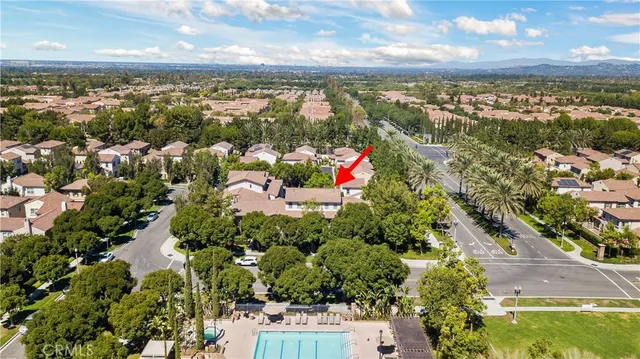 an aerial view of a houses with a lake view