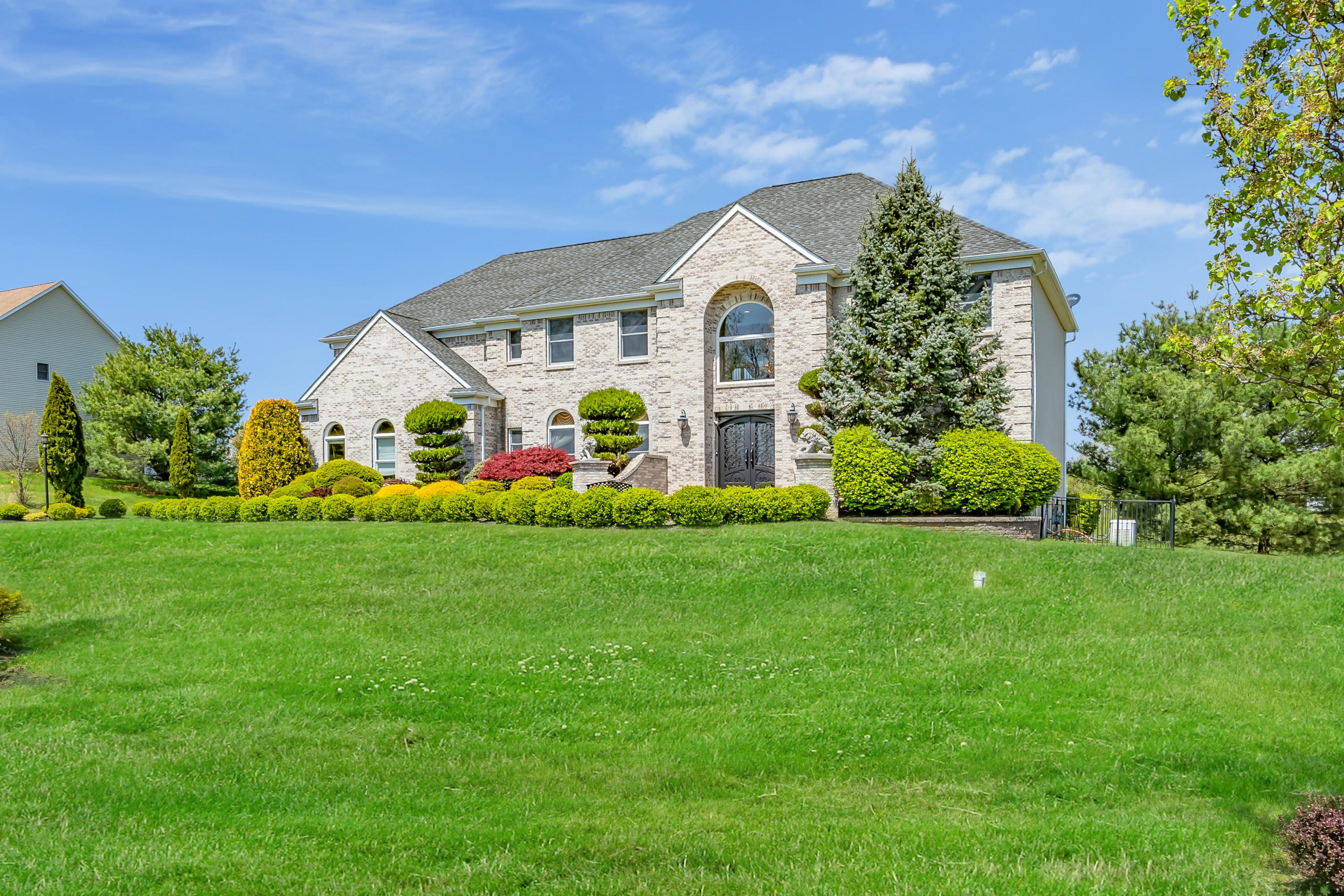 a front view of a house with garden