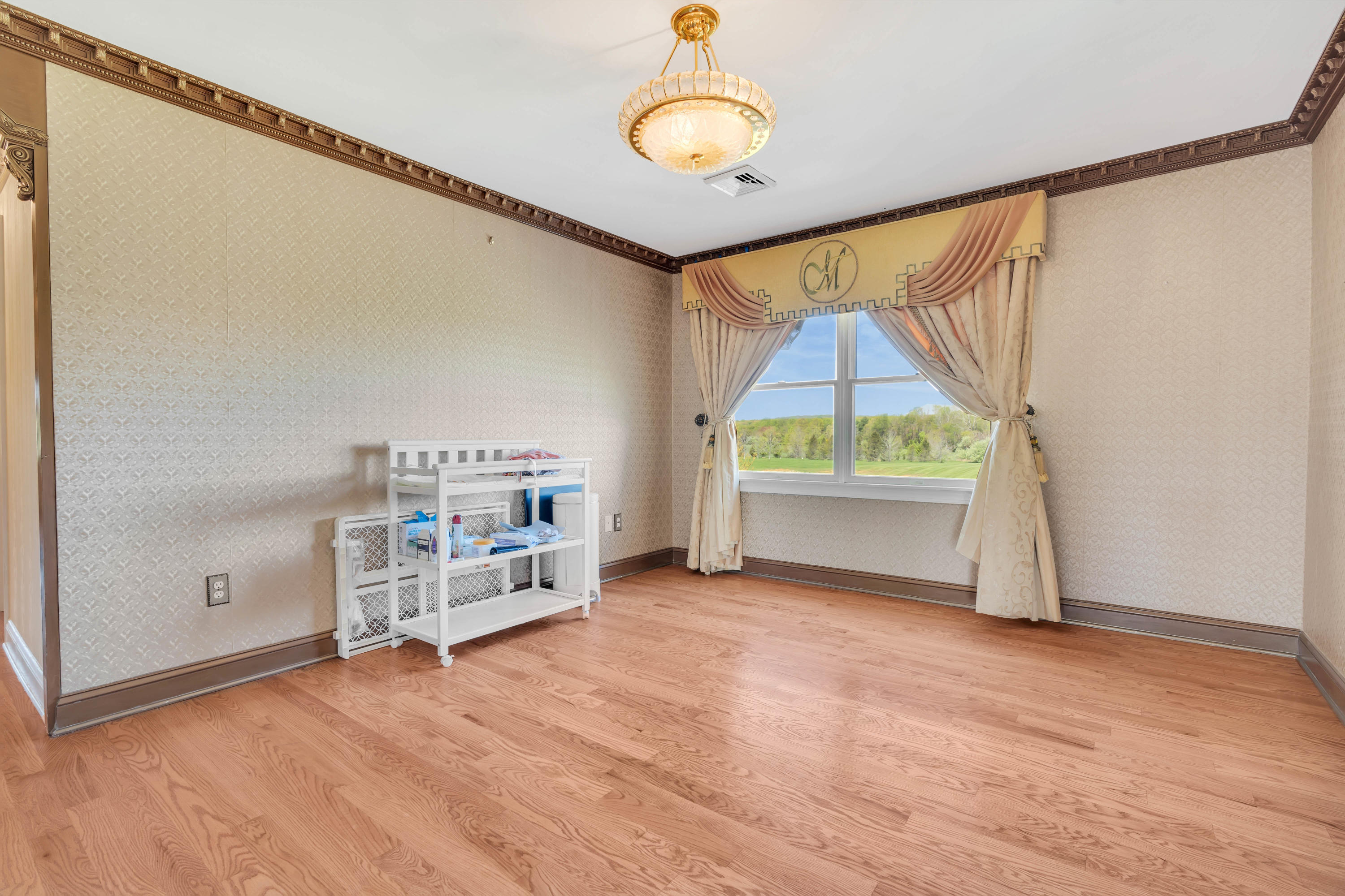 60 Yellow Meetinghouse Road Cream Ridge, NJ 08514 - Photo 28 of 33 a view of an empty room with a window and wooden floor