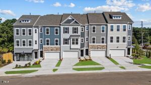 6108 Dunzo Drive Raleigh, NC 27617 - Photo 1 of 32 a front view of residential houses and street