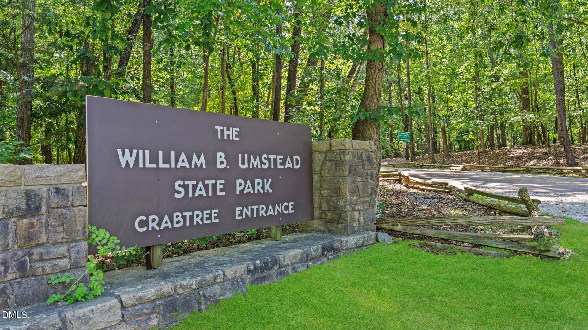 6108 Dunzo Drive Raleigh, NC 27617 - Photo 24 of 32 a sign on the side of the road