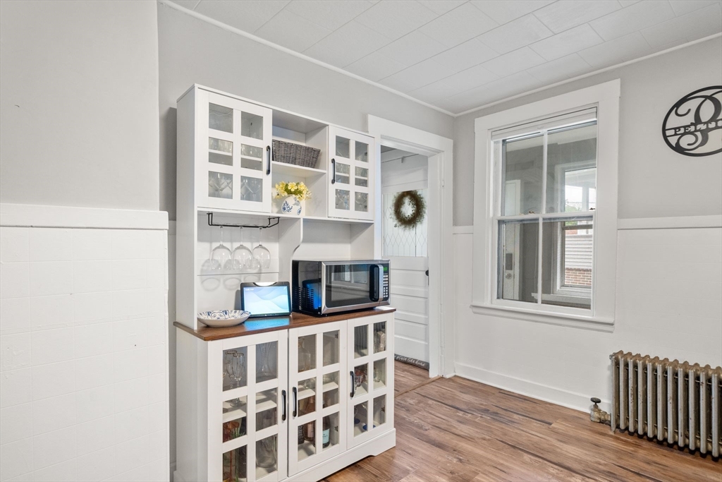 56 Ruggles Street Franklin, MA 02038 - Photo 13 of 42 a view of wooden floor and windows in a room