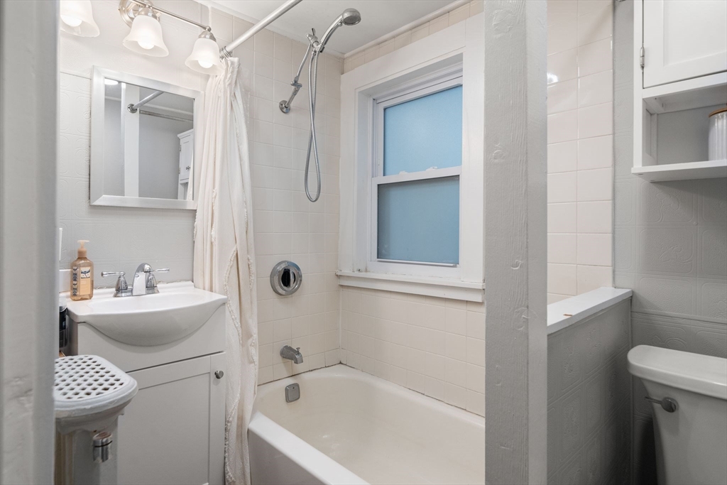 56 Ruggles Street Franklin, MA 02038 - Photo 15 of 42 a bathroom with a sink a toilet and shower