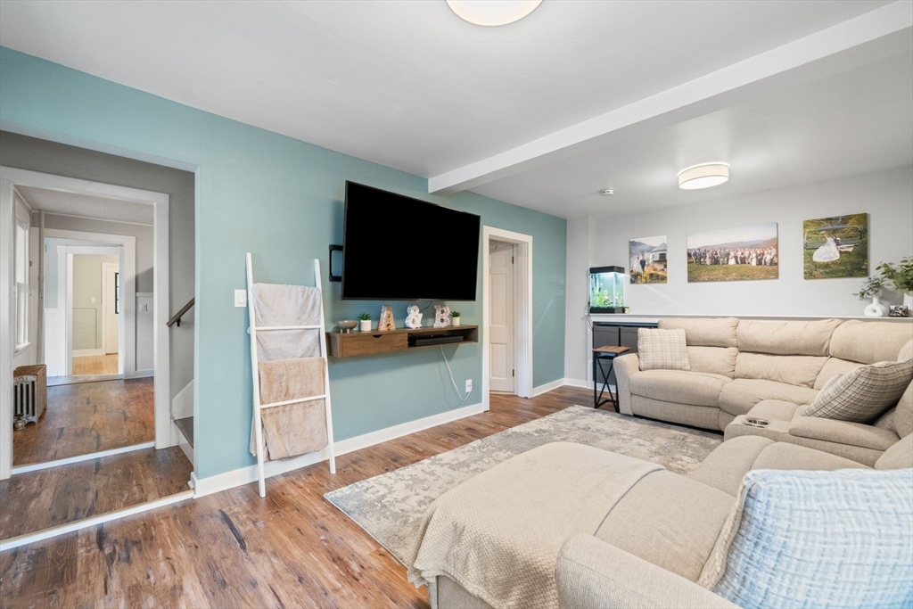 56 Ruggles Street Franklin, MA 02038 - Photo 16 of 42 a bedroom with a bed and a flat screen tv