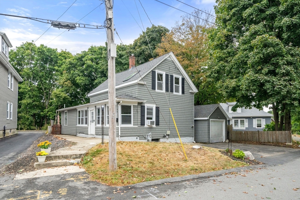 56 Ruggles Street Franklin, MA 02038 - Photo 2 of 42 a front view of a house with garden