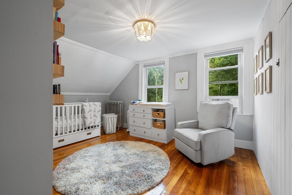 56 Ruggles Street Franklin, MA 02038 - Photo 26 of 42 a living room with furniture and a wooden floor