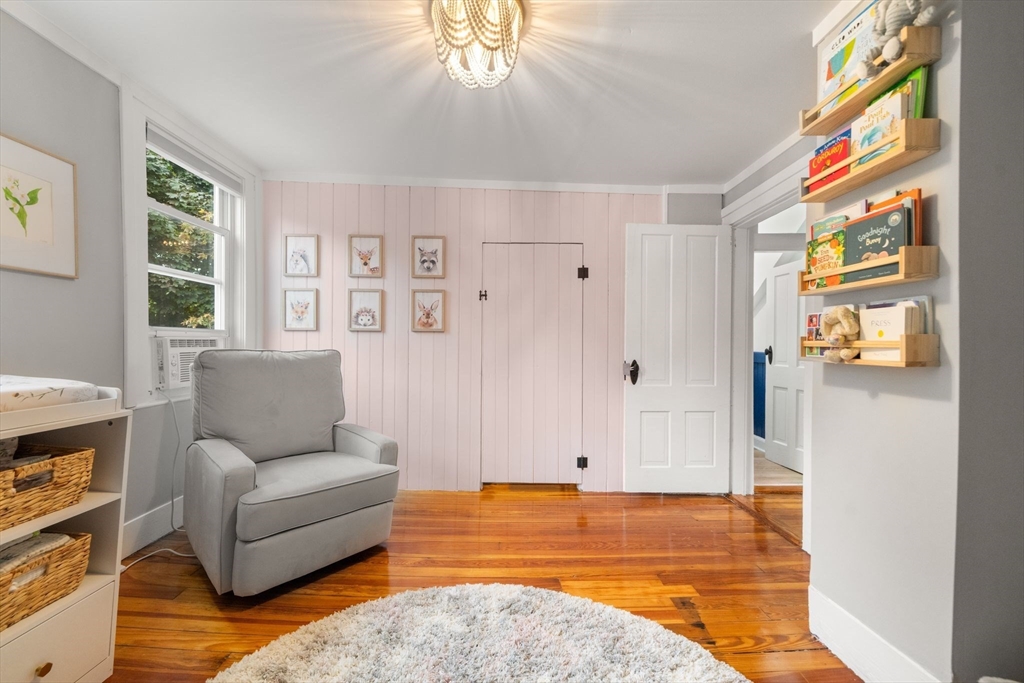 56 Ruggles Street Franklin, MA 02038 - Photo 27 of 42 a living room with furniture and a flat screen tv