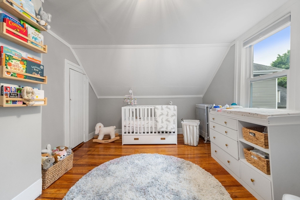 56 Ruggles Street Franklin, MA 02038 - Photo 30 of 42 a view of a bedroom with furniture and window