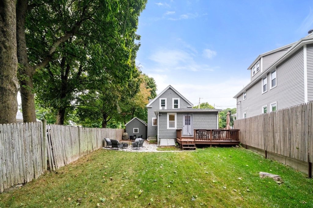 56 Ruggles Street Franklin, MA 02038 - Photo 36 of 42 a view of a house with backyard and porch
