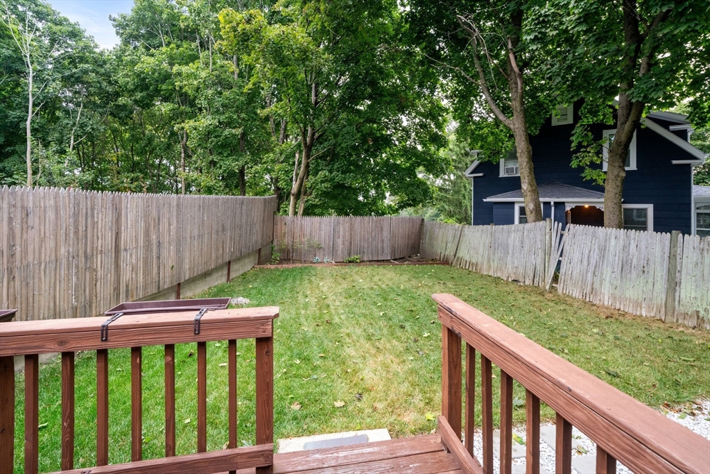 56 Ruggles Street Franklin, MA 02038 - Photo 38 of 42 a view of a deck with a fence