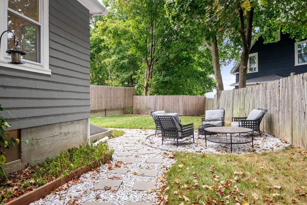 56 Ruggles Street Franklin, MA 02038 - Photo 39 of 42 a backyard of a house with table and chairs