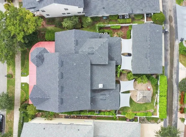 an aerial view of a house with a swimming pool