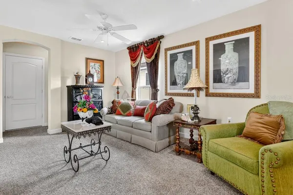 a living room with furniture and a window