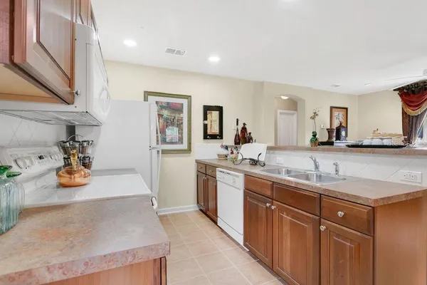 a kitchen with sink and stove