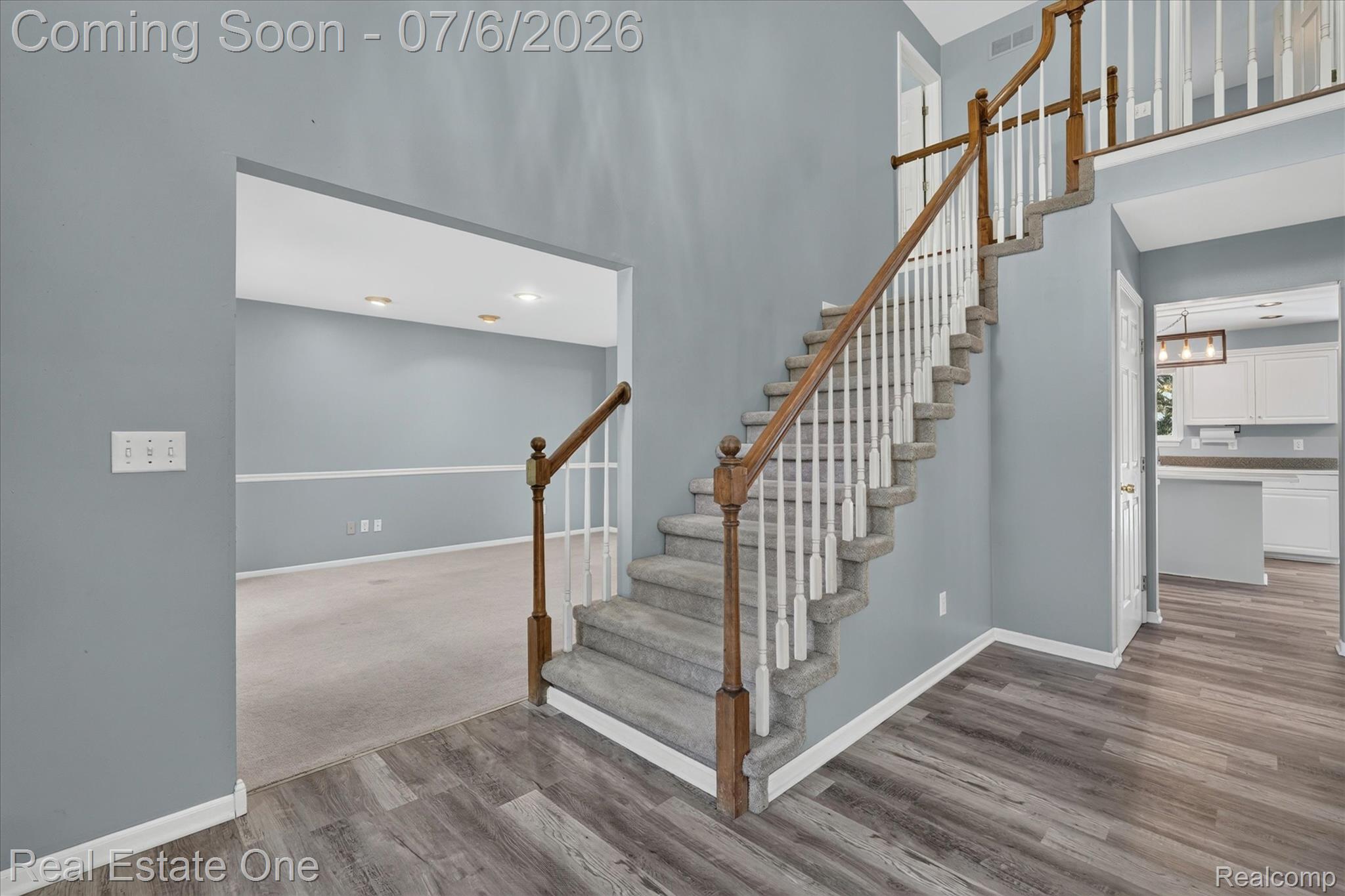 9610 Forest Ridge Drive Clarkston, MI 48348 - Photo 5 of 77 From the moment you enter, expansive sightlines draw your eye through the formal living space, into the kitchen, and upward along the staircase, creating a seamless sense of flow and architectural openness.