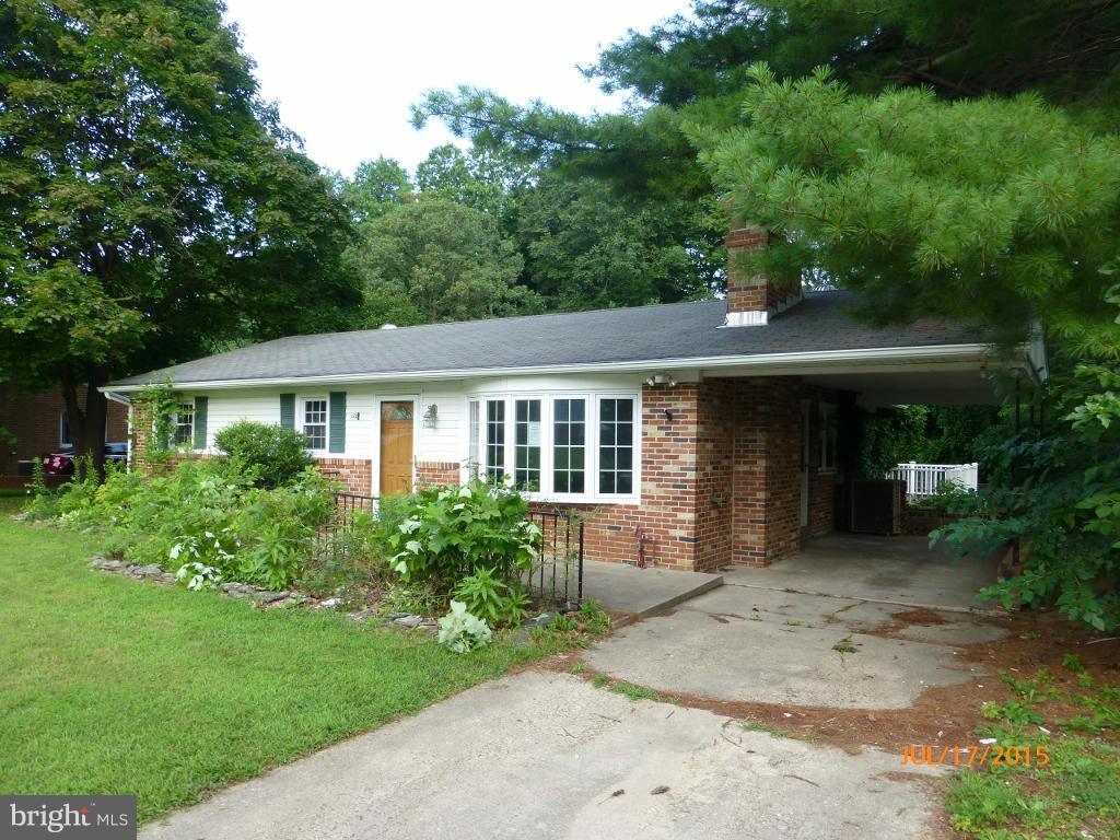 232 Bynum Ridge Road Forest Hill, MD 21050 - Photo 1 of 21 a front view of a house with a garden and porch