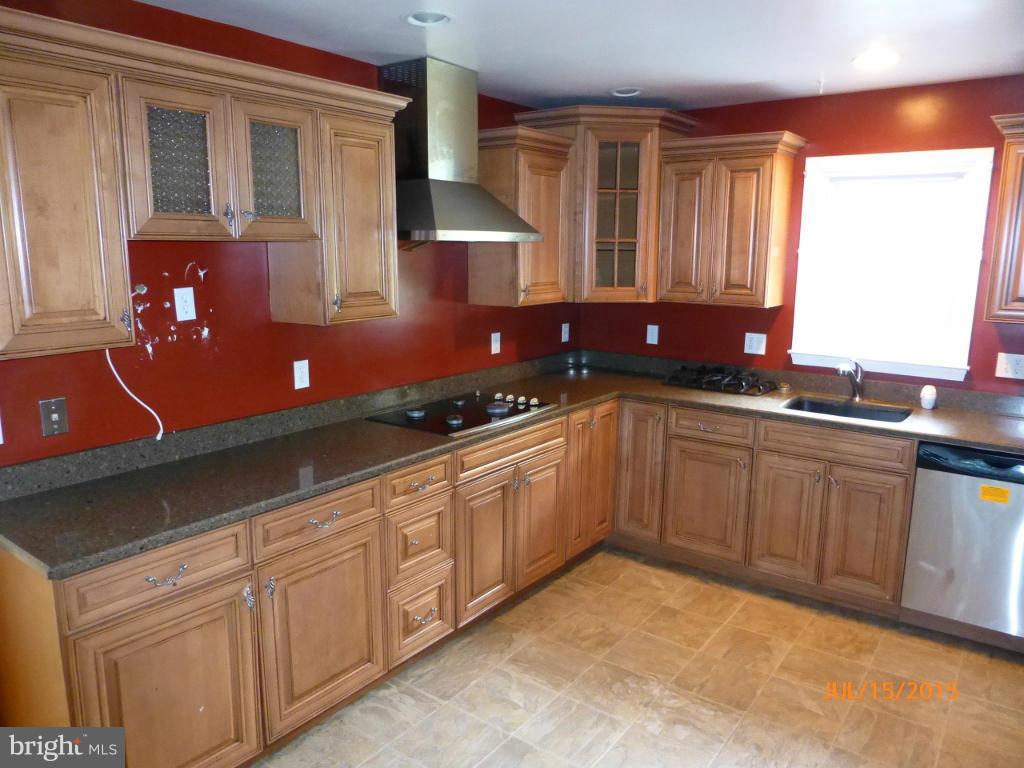 232 Bynum Ridge Road Forest Hill, MD 21050 - Photo 10 of 21 a kitchen with granite countertop a sink and cabinets