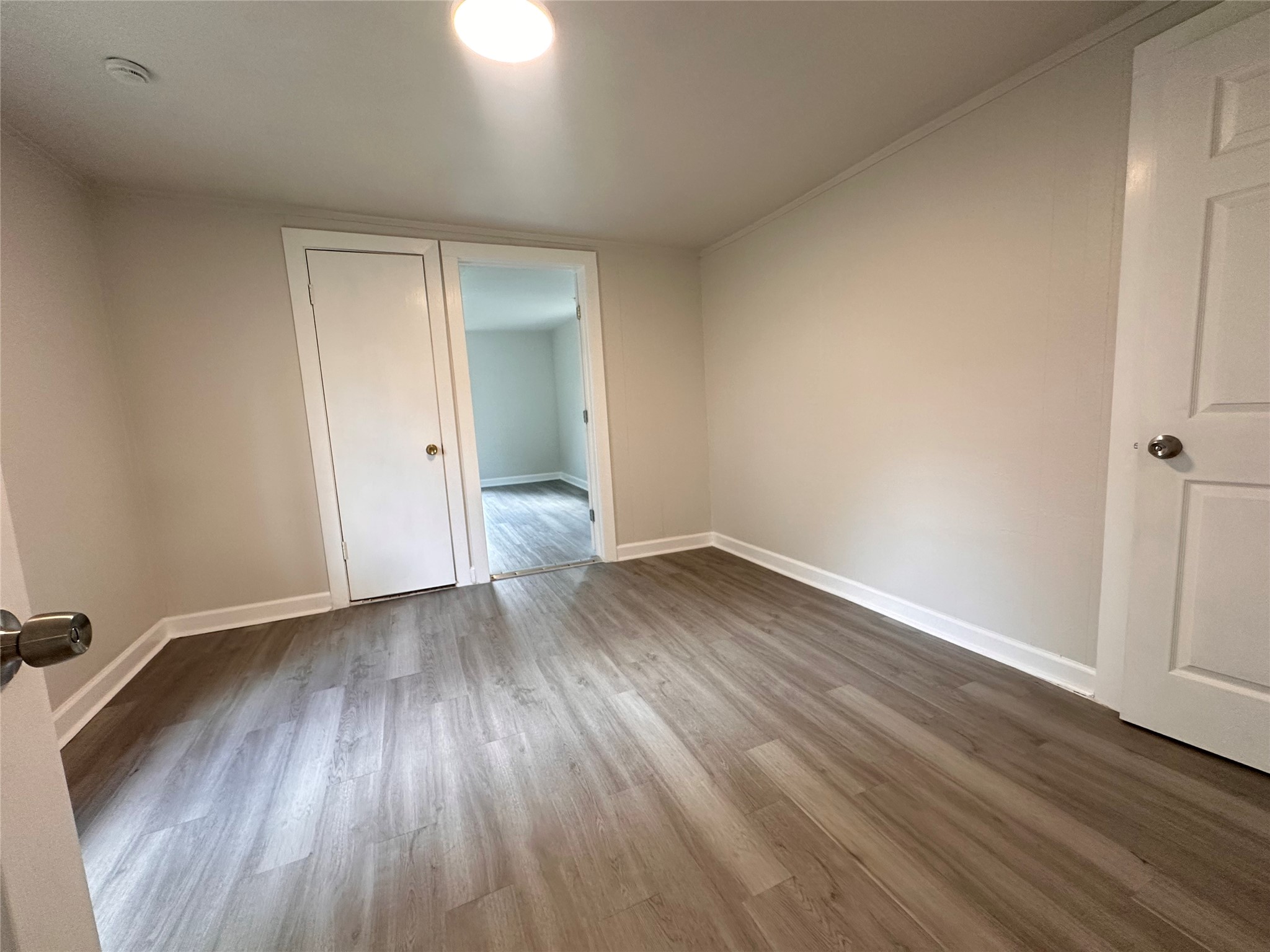 2516 Ivy Street Houston, TX 77026 - Photo 4 of 9 a view of an empty room and wooden floor