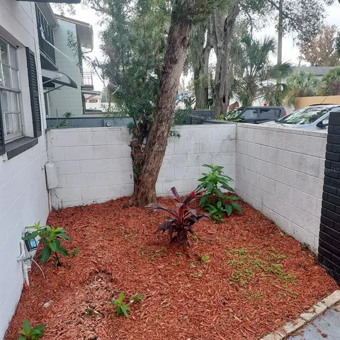a wooden bench sitting in front of a building