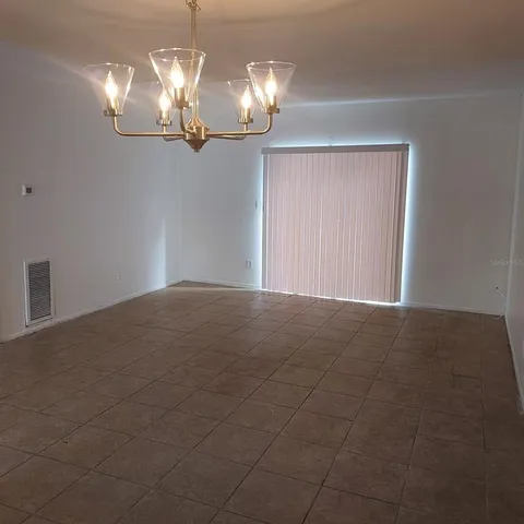 a view of a chandelier in big room