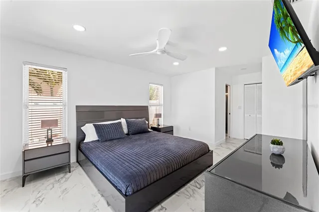 a bedroom with a bed and a couch