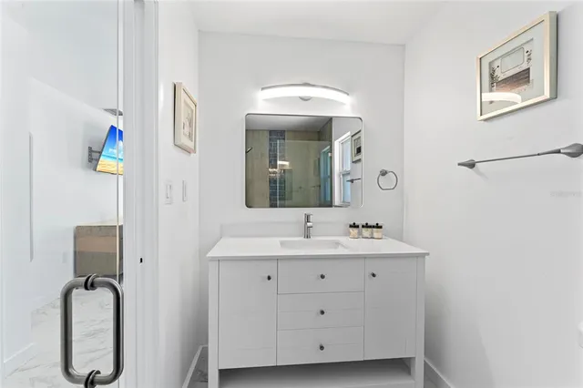 a bathroom with a sink and a mirror