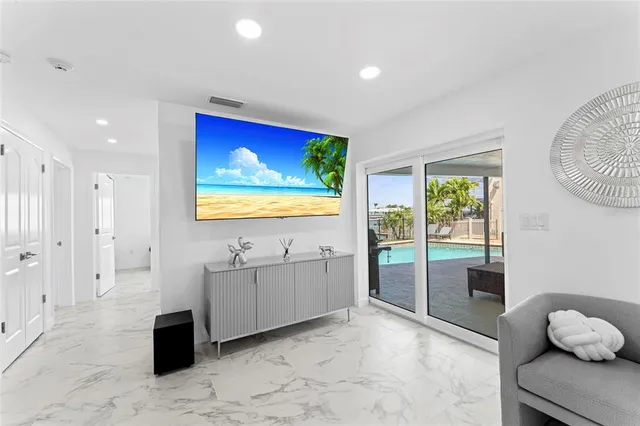 a bedroom with furniture and a chandelier