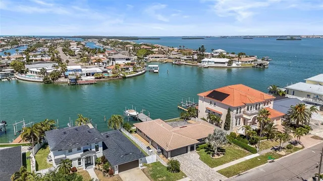an aerial view of a house with a lake view