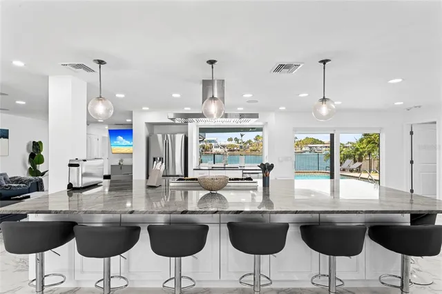 a kitchen with granite countertop a sink cabinets and window