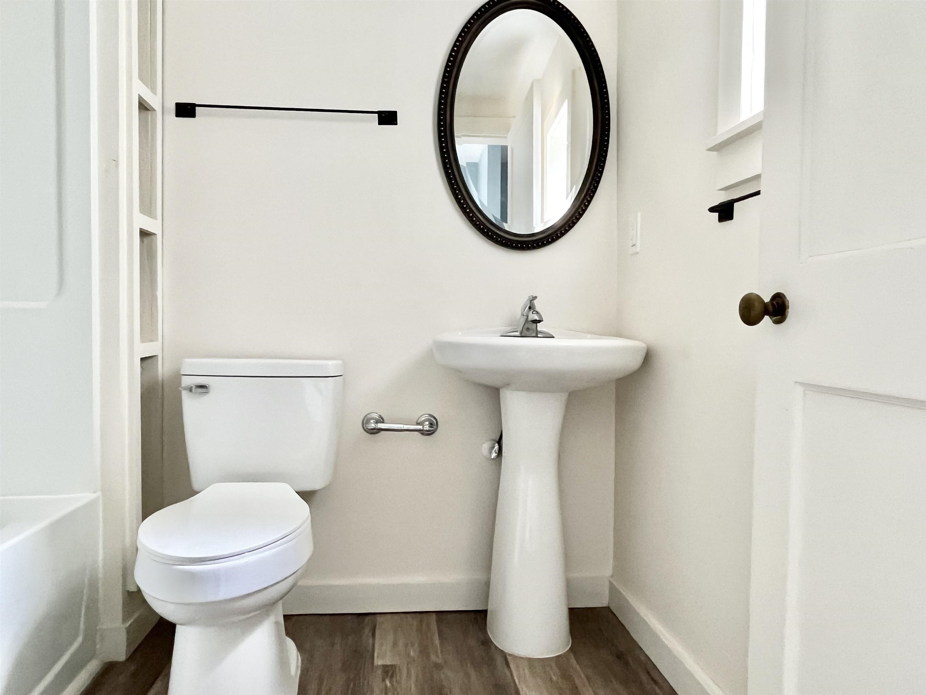 8 Rohde Avenue, Unit 4 St. Augustine, FL 32084 - Photo 2 of 18 a bathroom with a sink and a mirror