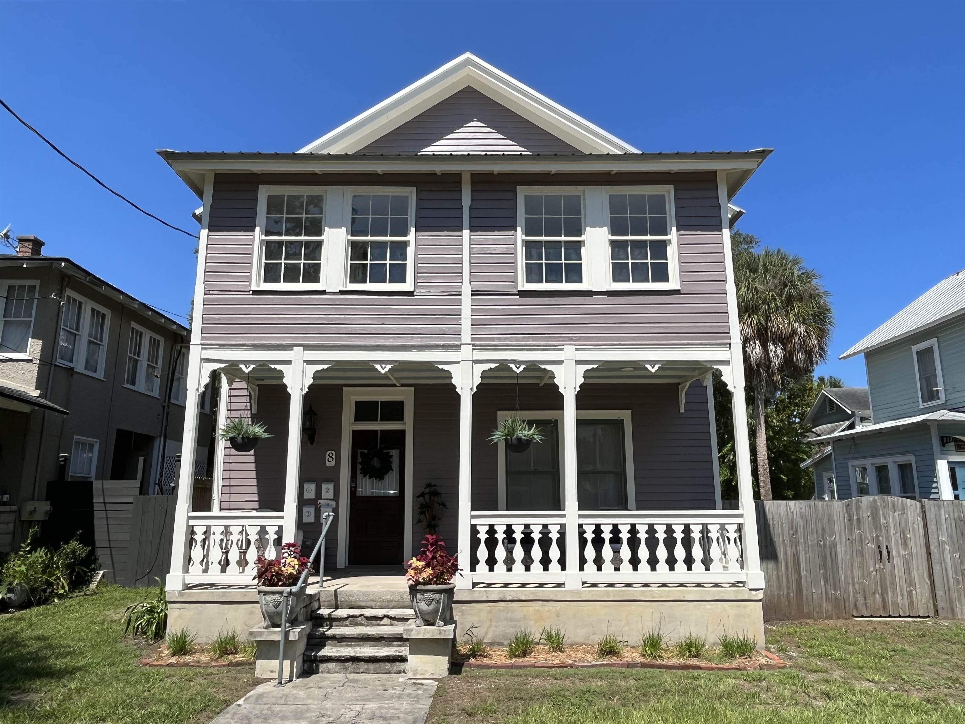 8 Rohde Avenue, Unit 4 St. Augustine, FL 32084 - Photo 7 of 18 a front view of a house with a yard