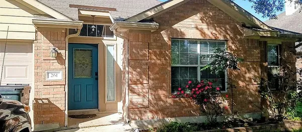 a view of a house with a potted plant
