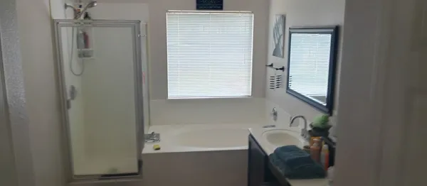 a bathroom with a bathtub and a sink