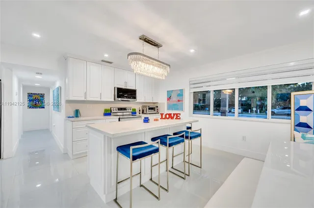 a bedroom with a large bed and a large window