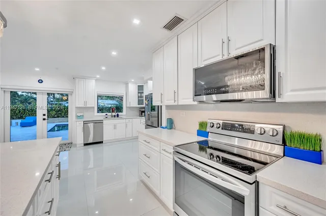 a bathroom with a tub sink and a shower