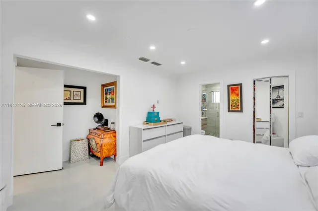 a bedroom with toys and a couch