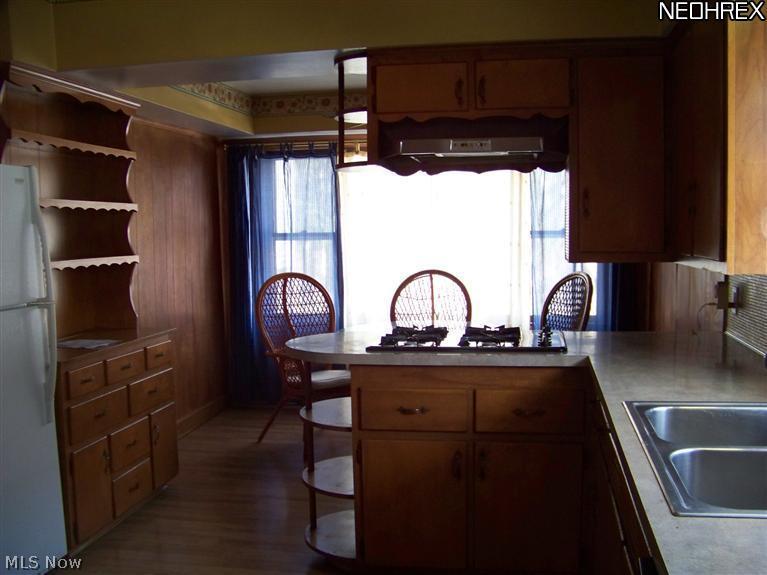 249 Center Road Bedford, OH 44146 - Photo 8 of 25 Country style eat in kitchen with large window overlooking backyard