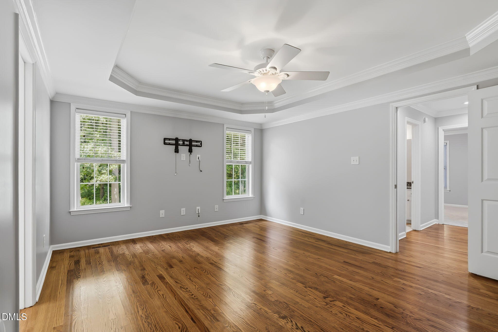 1112 Tyler Farms Drive Raleigh, NC 27603 - Photo 28 of 78 a view of an empty room with wooden floor and a window