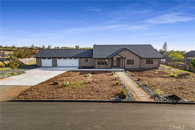 a view of house with swimming pool and mountains in the background